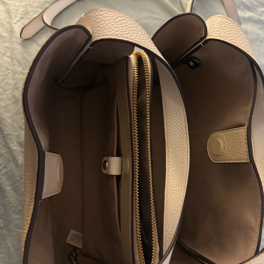 New, carried just a couple of times, just a little too dressy for me.